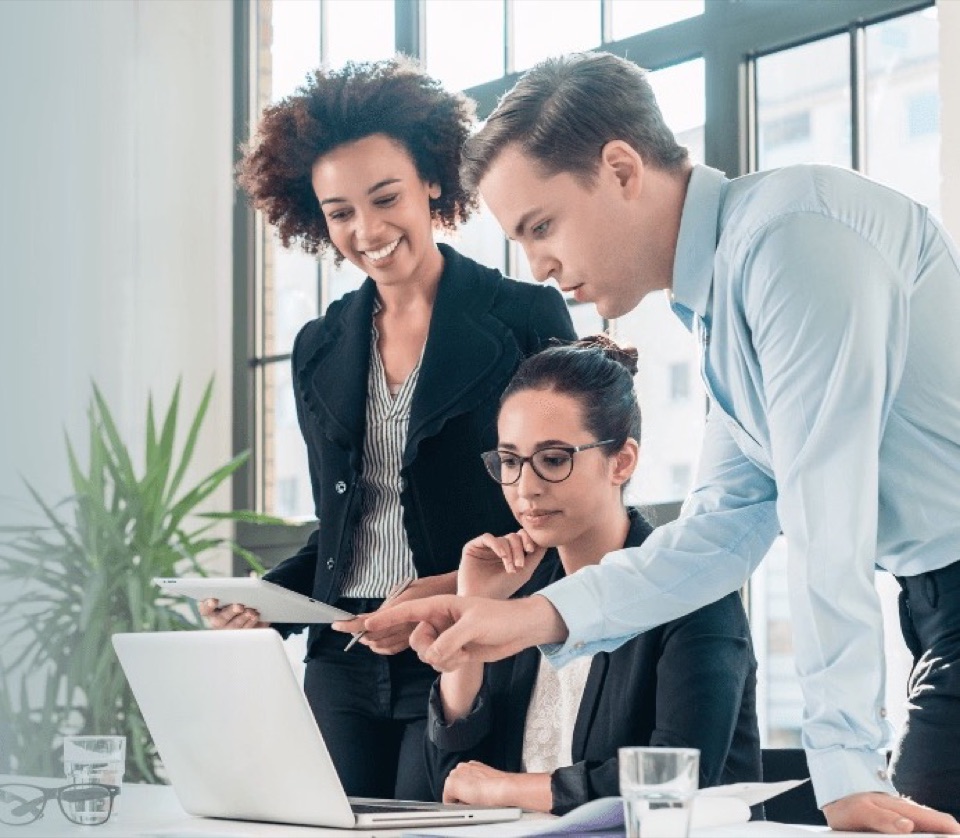 Three professionals in business suits representing the managed services team