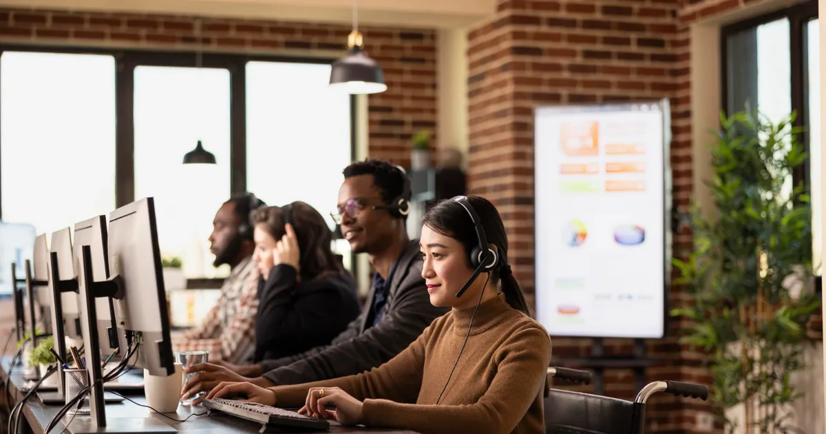 Support team at workstations, representing ongoing NetSuite support and administration